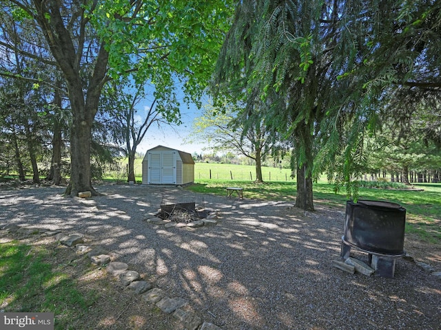 917 Houtztown Rd, Myerstown, PA 17067 - view of yard featuring a storage unit, an outbuilding, and an outdoor fire pit