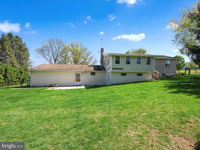 917 Houtztown Rd, Myerstown, PA 17067 - rear view of property with fence, a chimney, a yard, and a patio area