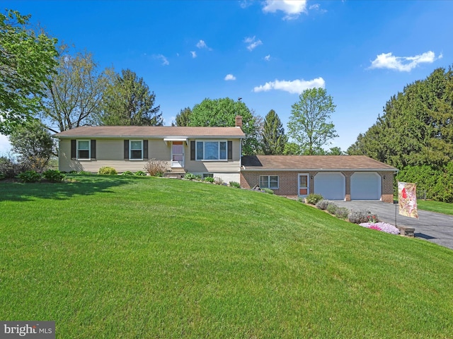 917 Houtztown Rd, Myerstown, PA 17067 - ranch-style house with an attached garage, aphalt driveway, a front yard, and a chimney