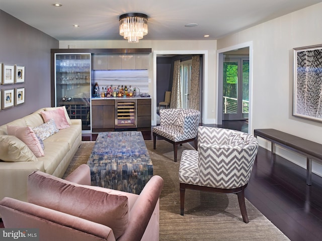living room featuring recessed lighting, wine cooler, wood finished floors, and a chandelier