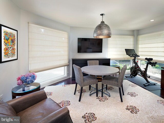 dining area with recessed lighting and wood finished floors
