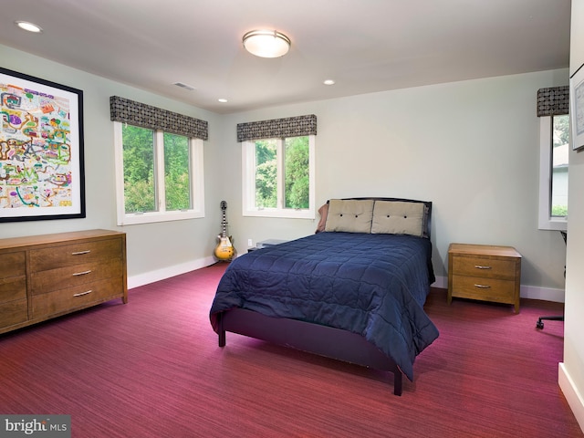 bedroom featuring baseboards and recessed lighting