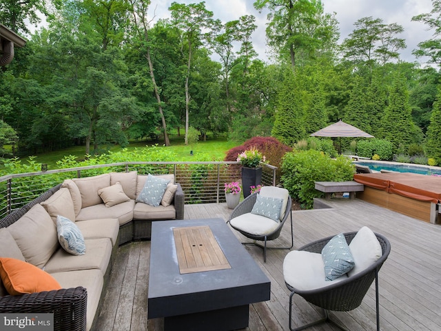 wooden deck with outdoor lounge area and an outdoor pool