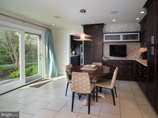 dining area with recessed lighting, washer / dryer, and light tile patterned floors