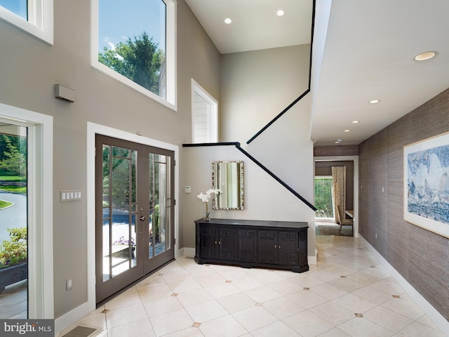 entryway featuring french doors, recessed lighting, baseboards, and an accent wall