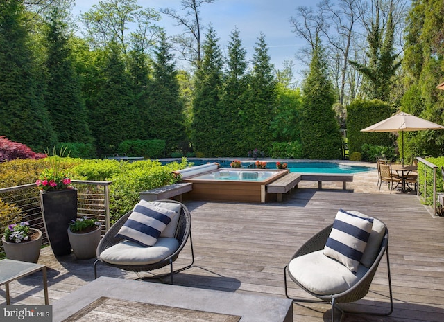 wooden terrace with an in ground hot tub, an outdoor pool, and outdoor dining space