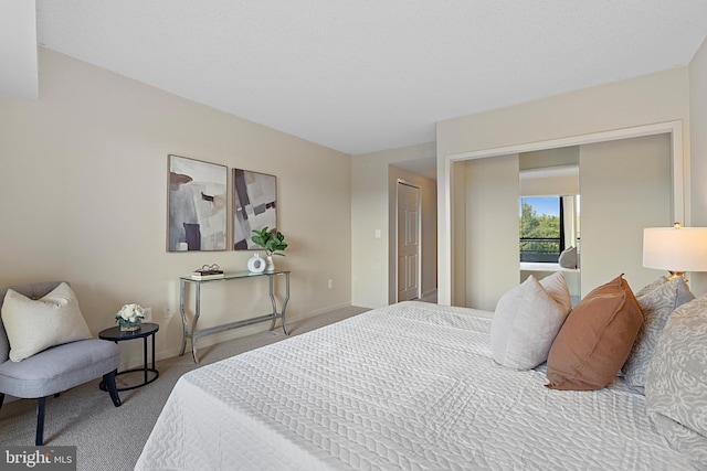 carpeted bedroom with baseboards