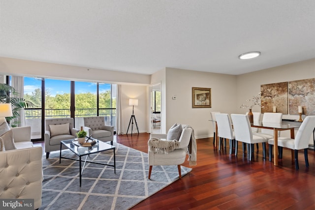 living area featuring baseboards and wood finished floors