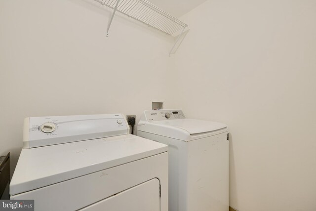 clothes washing area featuring washing machine and dryer