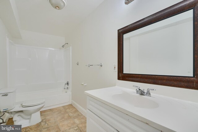 full bath featuring toilet, vanity, shower / washtub combination, and baseboards