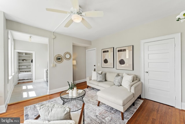 1527 Park Rd NW Unit 302, Washington, DC 20010 - living room featuring a ceiling fan, baseboards, and wood finished floors