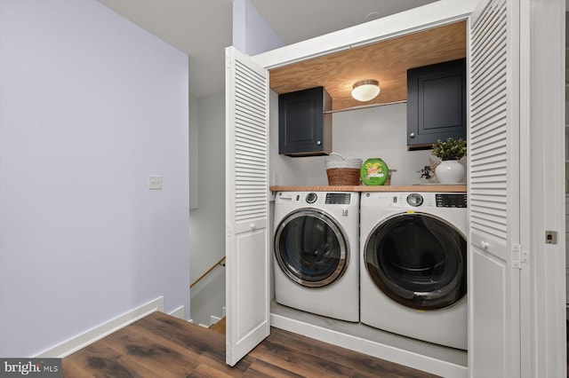 washroom featuring cabinet space, separate washer and dryer, dark wood-style floors, and baseboards
