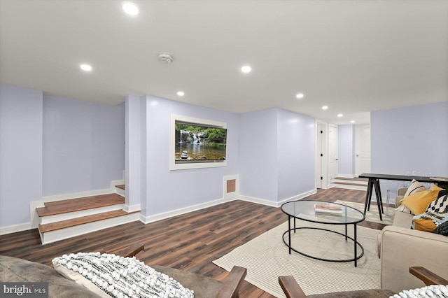 living room featuring baseboards, wood finished floors, recessed lighting, and stairway
