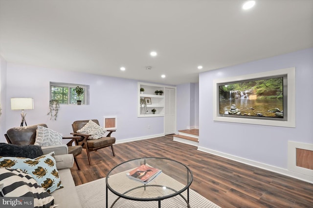 living room with dark wood-style flooring, recessed lighting, and baseboards