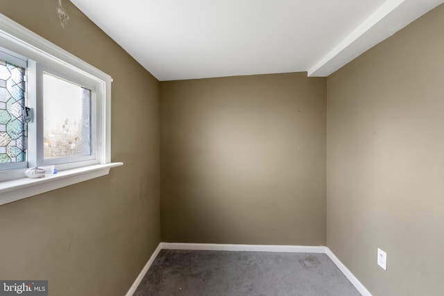 unfurnished room with carpet floors, baseboards, and a healthy amount of sunlight