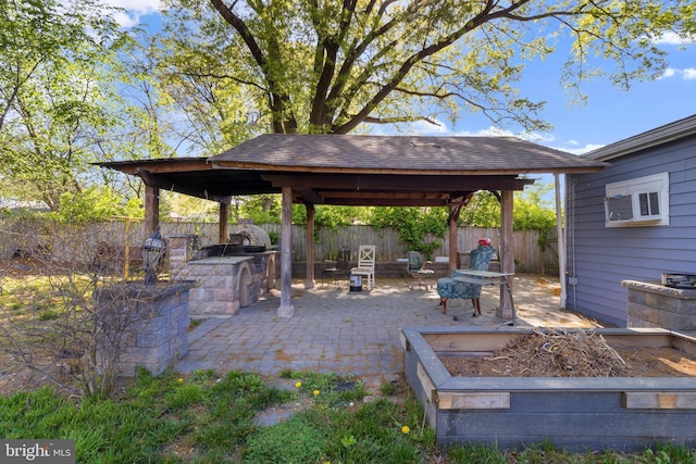 view of patio with a fenced backyard and a gazebo