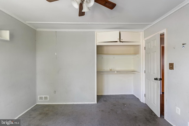 unfurnished bedroom featuring visible vents, carpet, baseboards, and a closet