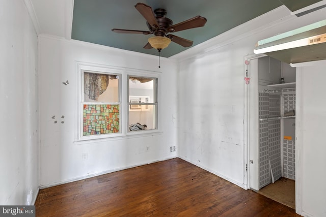 unfurnished bedroom featuring ornamental molding and wood finished floors