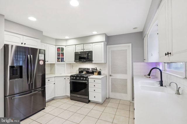 595 Tabernacle Rd, Medford, NJ 08055 - kitchen featuring stainless steel refrigerator with ice dispenser, range with gas stovetop, black microwave, backsplash, and recessed lighting