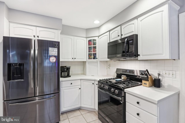 595 Tabernacle Rd, Medford, NJ 08055 - kitchen featuring appliances with stainless steel finishes, white cabinets, decorative backsplash, light countertops, and recessed lighting
