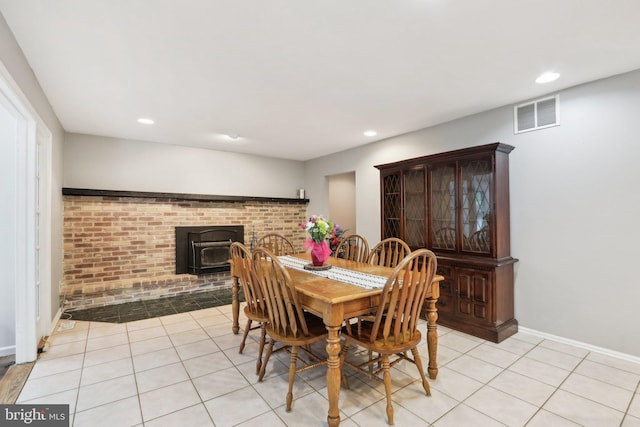 595 Tabernacle Rd, Medford, NJ 08055 - dining space featuring a wood stove, light tile patterned floors, recessed lighting, and baseboards