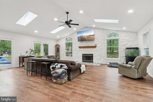 595 Tabernacle Rd, Medford, NJ 08055 - living area featuring a skylight, a stone fireplace, recessed lighting, wood finished floors, and a ceiling fan