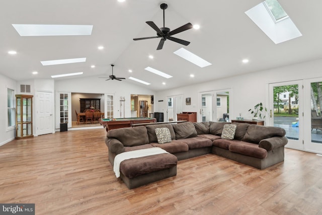 595 Tabernacle Rd, Medford, NJ 08055 - living area featuring a skylight, lofted ceiling, french doors, light wood-type flooring, and recessed lighting