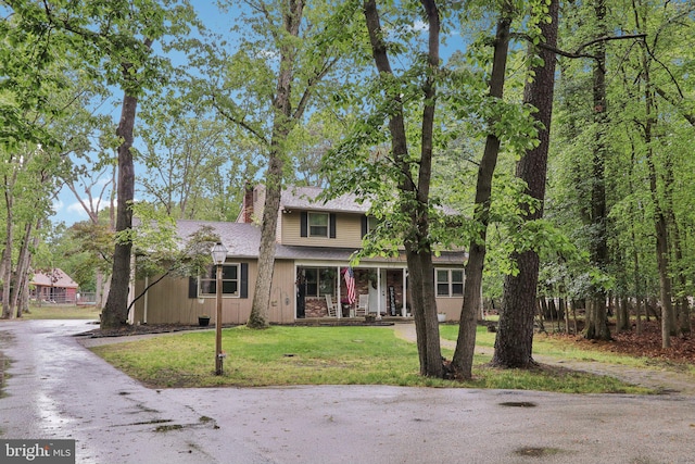 595 Tabernacle Rd, Medford, NJ 08055 - traditional-style home with a chimney, a front lawn, covered porch, and roof with shingles