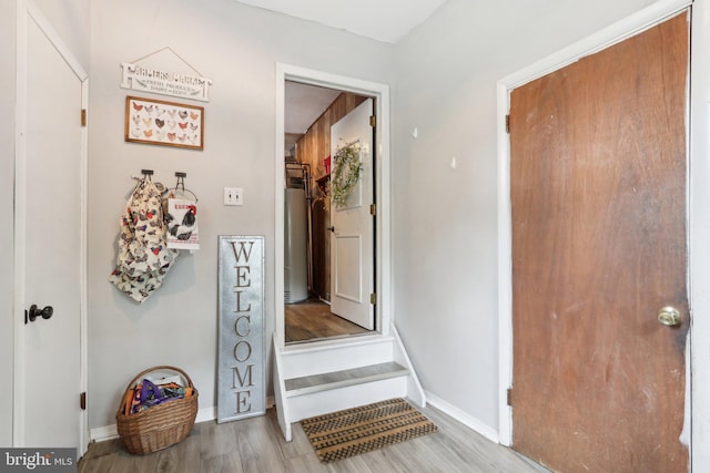 595 Tabernacle Rd, Medford, NJ 08055 - foyer entrance featuring wood finished floors, baseboards, and water heater
