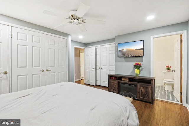 595 Tabernacle Rd, Medford, NJ 08055 - bedroom featuring two closets, baseboards, wood finished floors, recessed lighting, and ensuite bathroom