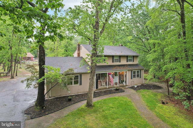 595 Tabernacle Rd, Medford, NJ 08055 - traditional home with a porch, roof with shingles, a front yard, and a chimney