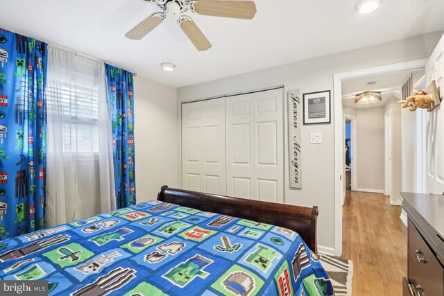 595 Tabernacle Rd, Medford, NJ 08055 - bedroom featuring a closet, light wood-style floors, baseboards, and ceiling fan