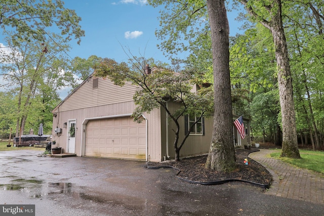 595 Tabernacle Rd, Medford, NJ 08055 - view of property exterior with a garage and driveway