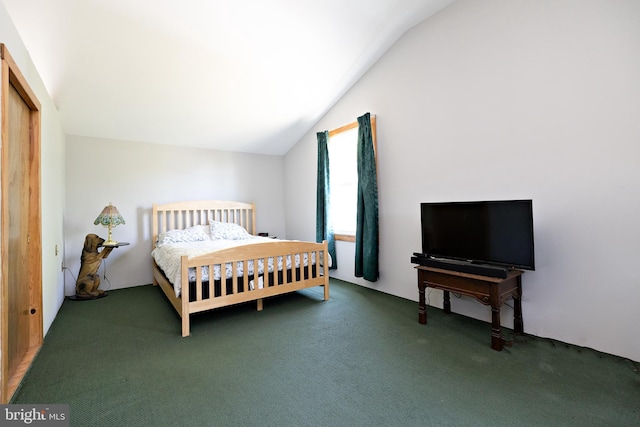 carpeted bedroom with lofted ceiling