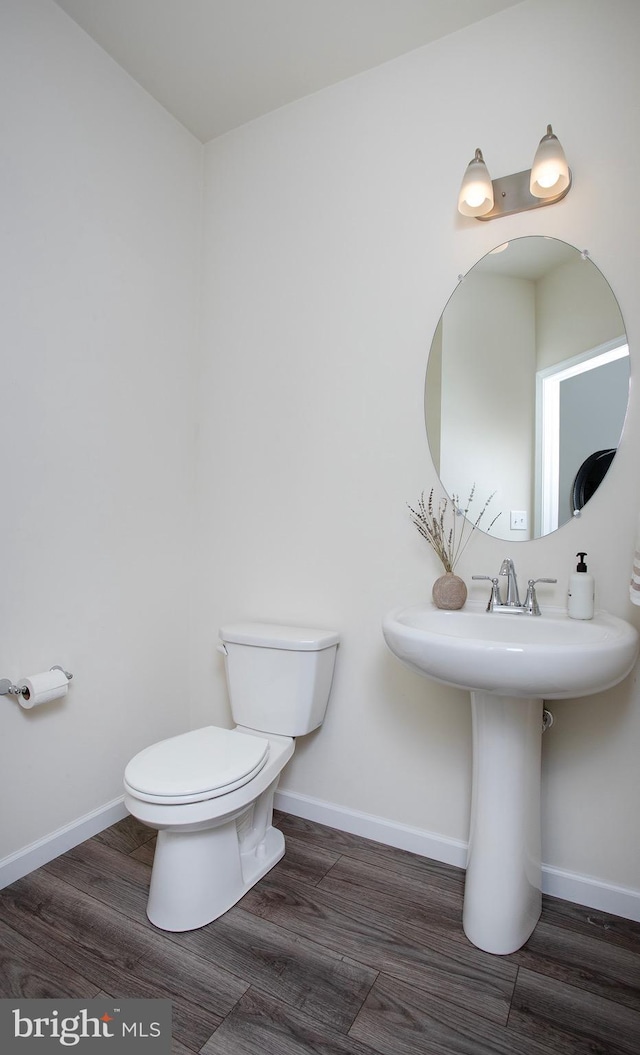 807 Anthony Dr, Harrisburg, PA 17111 - half bath with wood finished floors, toilet, and baseboards