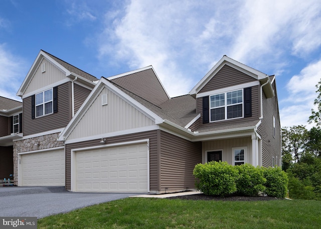807 Anthony Dr, Harrisburg, PA 17111 - craftsman inspired home featuring asphalt driveway, board and batten siding, a shingled roof, and a garage