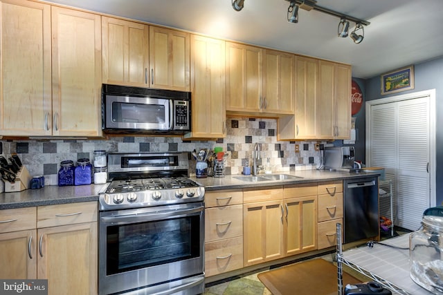 263 Medwick Garth E, Baltimore, MD 21228 - kitchen featuring appliances with stainless steel finishes, a sink, light brown cabinets, tasteful backsplash, and dark countertops