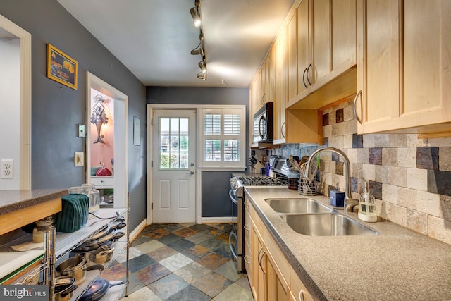 263 Medwick Garth E, Baltimore, MD 21228 - kitchen with stainless steel range with gas stovetop, a sink, light brown cabinetry, backsplash, and dark stone finish floors
