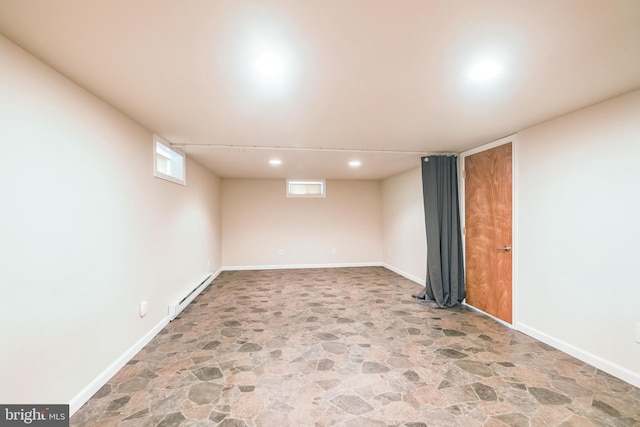 10918 Allen Ave, Hagerstown, MD 21740 - below grade area featuring baseboards, a baseboard radiator, stone floors, and recessed lighting