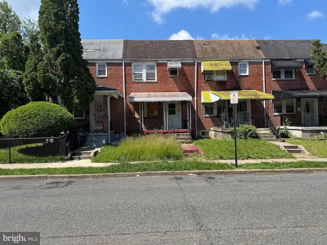 5312 Gist Ave, Baltimore, MD 21215 - view of property featuring mansard roof and brick siding