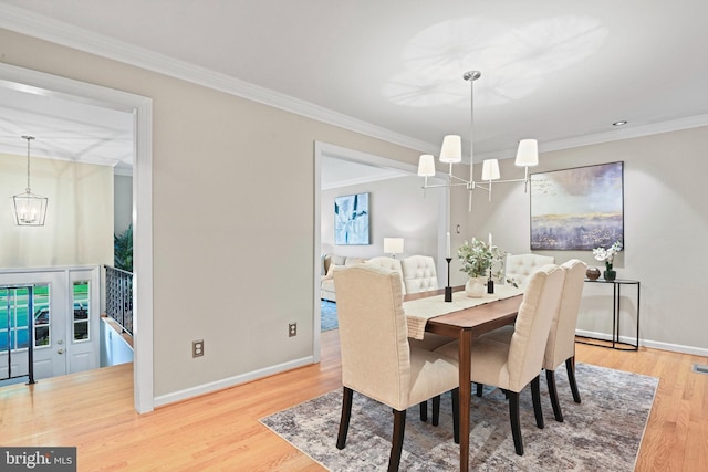 503 Colony Ct NW, Vienna, VA 22180 - dining space with a chandelier, wood finished floors, baseboards, and crown molding