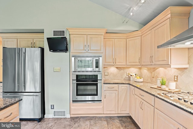503 Colony Ct NW, Vienna, VA 22180 - kitchen with stainless steel appliances, wall chimney range hood, lofted ceiling, stone counters, and tasteful backsplash