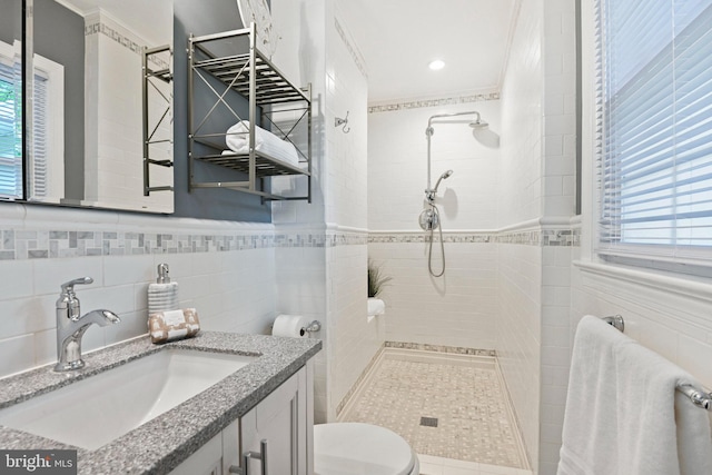 503 Colony Ct NW, Vienna, VA 22180 - bathroom with tiled shower, vanity, toilet, tile walls, and crown molding