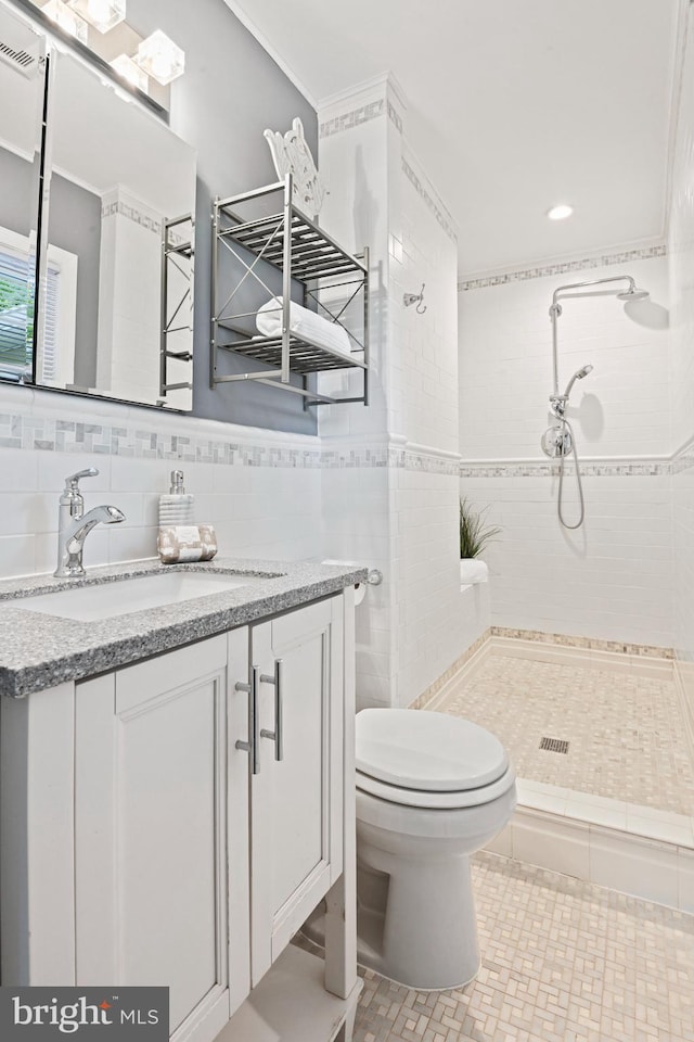 503 Colony Ct NW, Vienna, VA 22180 - full bathroom featuring a stall shower, vanity, toilet, tile walls, and tile patterned floors