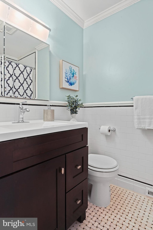 503 Colony Ct NW, Vienna, VA 22180 - full bath with tile walls, vanity, toilet, crown molding, and tile patterned flooring