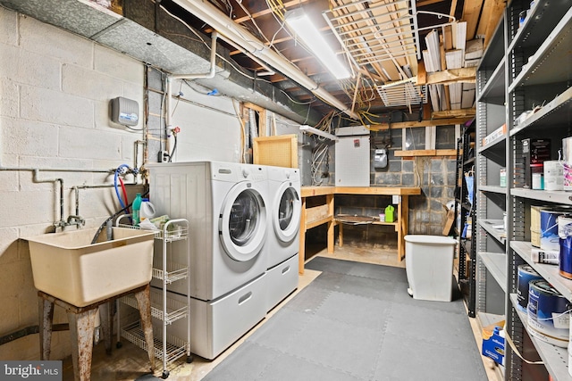 503 Colony Ct NW, Vienna, VA 22180 - unfinished below grade area featuring washer and clothes dryer, concrete block wall, and gas meter