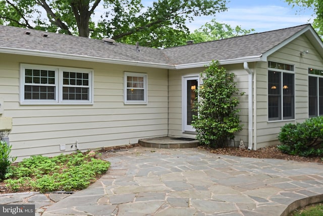 503 Colony Ct NW, Vienna, VA 22180 - back of property featuring a patio and a shingled roof