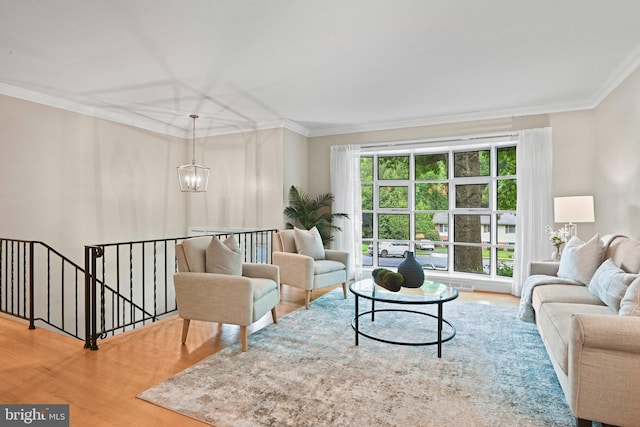 503 Colony Ct NW, Vienna, VA 22180 - living area featuring wood finished floors, ornamental molding, and a chandelier