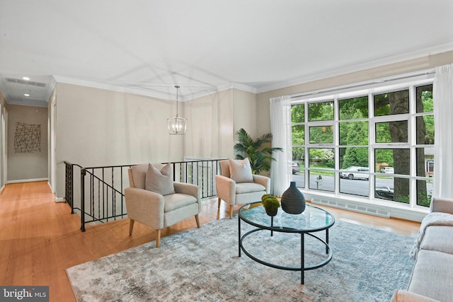 503 Colony Ct NW, Vienna, VA 22180 - living room with crown molding, wood finished floors, and a chandelier