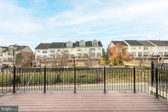 wooden deck featuring a residential view